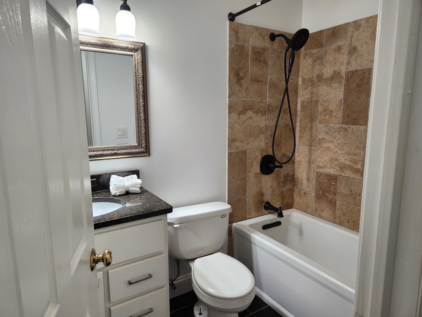 1597 Cove Drive, Unit 185C Prospect Heights, IL 60070 - Photo 7 of 12 a white toilet sitting next to a bath tub