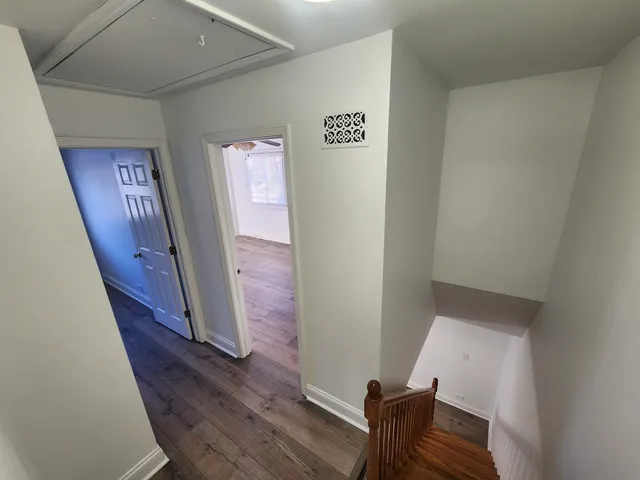 a view of an entryway with wooden floor