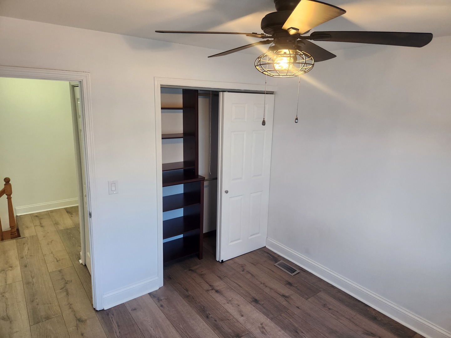 1597 Cove Drive, Unit 185C Prospect Heights, IL 60070 - Photo 10 of 12 wooden floor in an empty room with a window