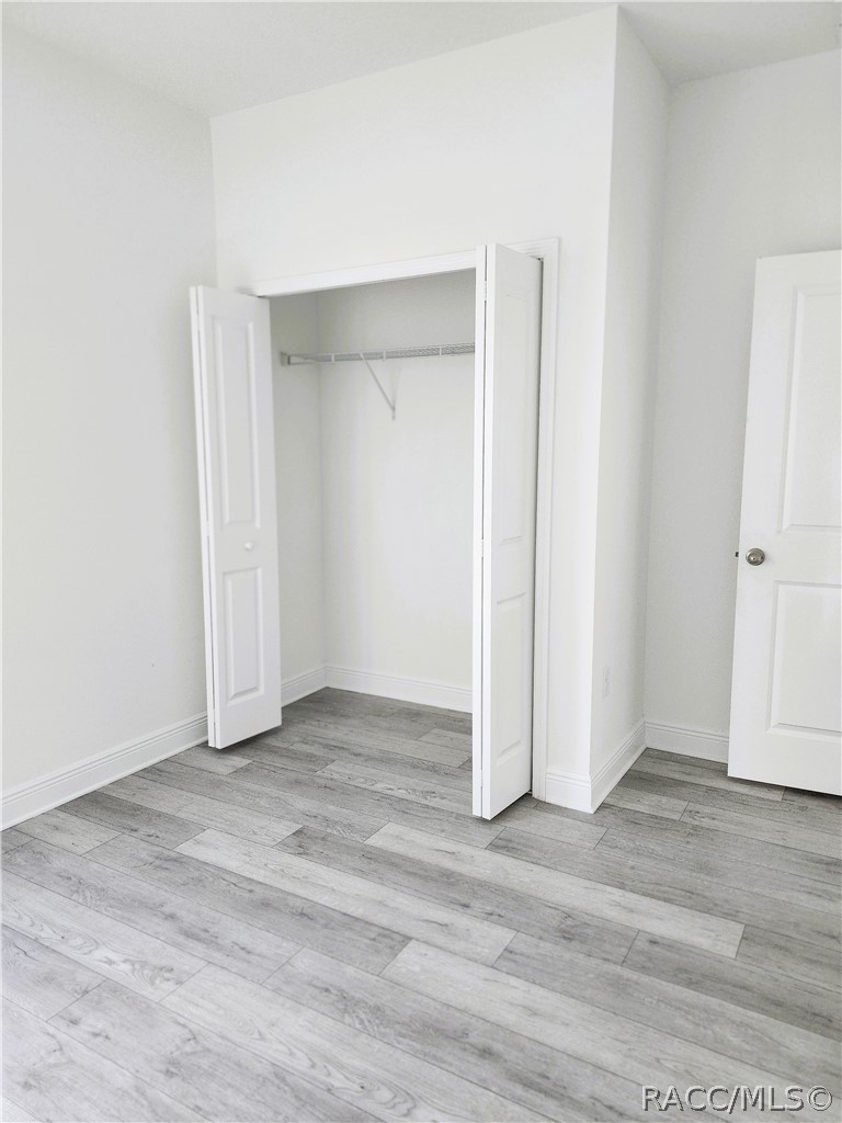 2800 Southwest 139th Street Ocala, FL 34473 - Photo 13 of 16 an empty room with wooden floor & closet area