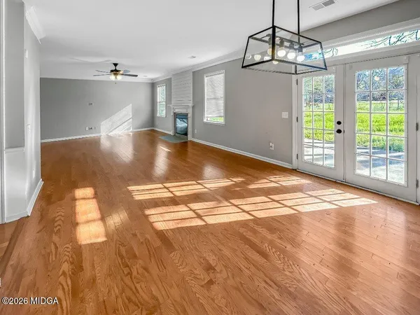 a kitchen with stainless steel appliances granite countertop a refrigerator a stove top oven a sink dishwasher and a refrigerator