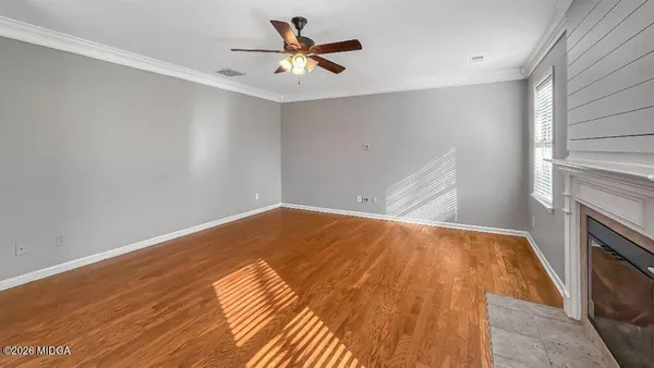 a view of an empty room with a window