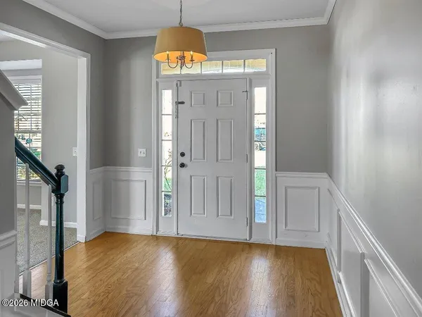 a view of an empty room with a ceiling fan