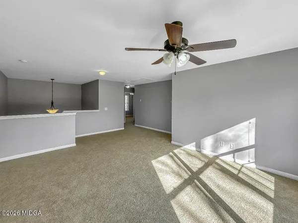 a view of an empty room with a window