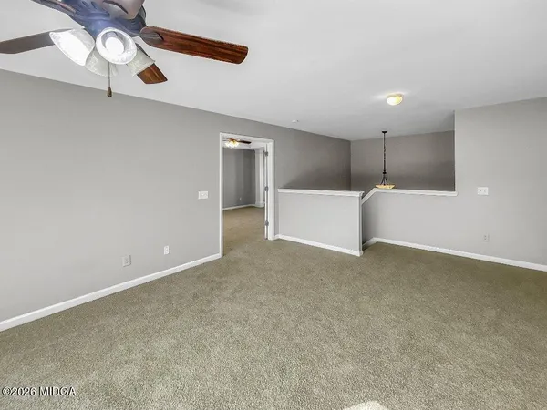 a view of a room that has a window in it