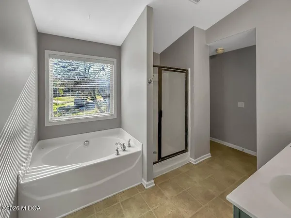 a bathroom with a toilet and a sink