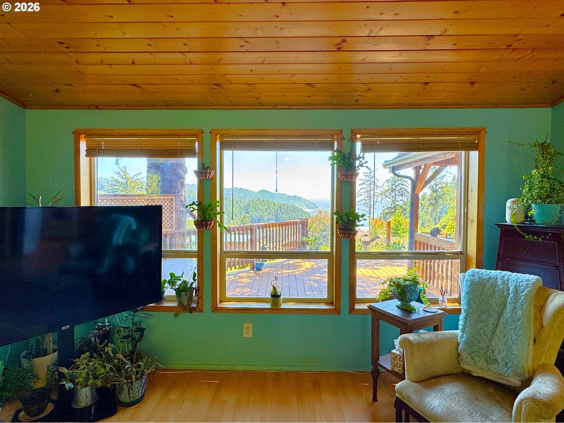 19921 Whaleshead Road, Unit U25 Brookings, OR 97415 - Photo 22 of 47 a living room with furniture and a large window