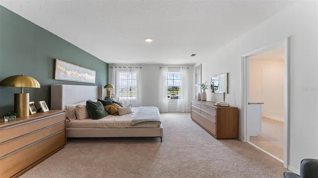 a bedroom with furniture and a window