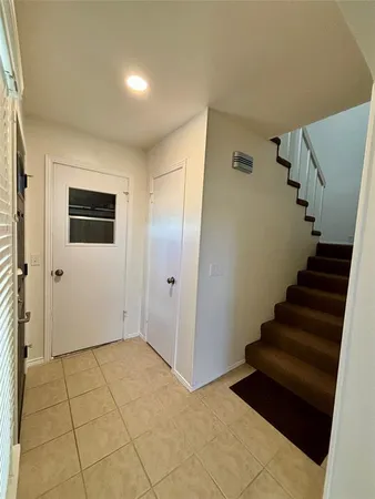 a view of entryway with stairs and wooden floor