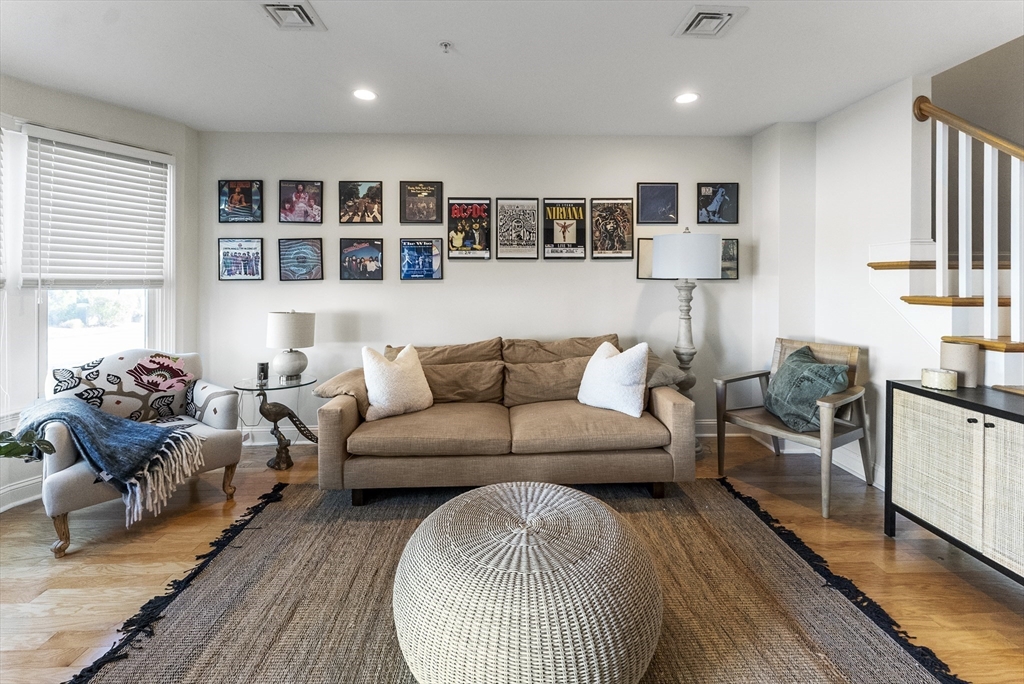 60 Robbins Road, Unit 25 Plymouth, MA 02360 - Photo 11 of 42 a living room with furniture and a wooden floor
