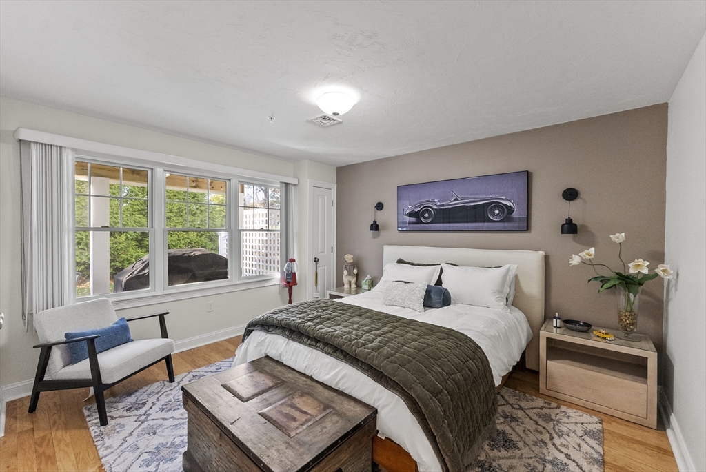 60 Robbins Road, Unit 25 Plymouth, MA 02360 - Photo 12 of 42 a bedroom with a bed and a large window