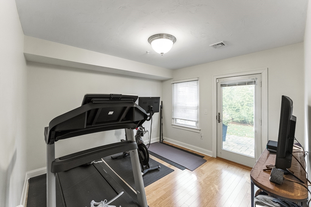 60 Robbins Road, Unit 25 Plymouth, MA 02360 - Photo 14 of 42 a view of a room with gym equipment and a window