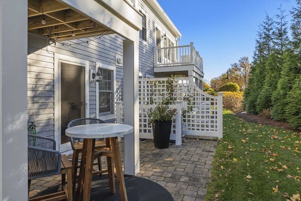 60 Robbins Road, Unit 25 Plymouth, MA 02360 - Photo 15 of 42 a view of a chairs and table in the patio