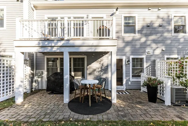 a view of a house with outdoor seating