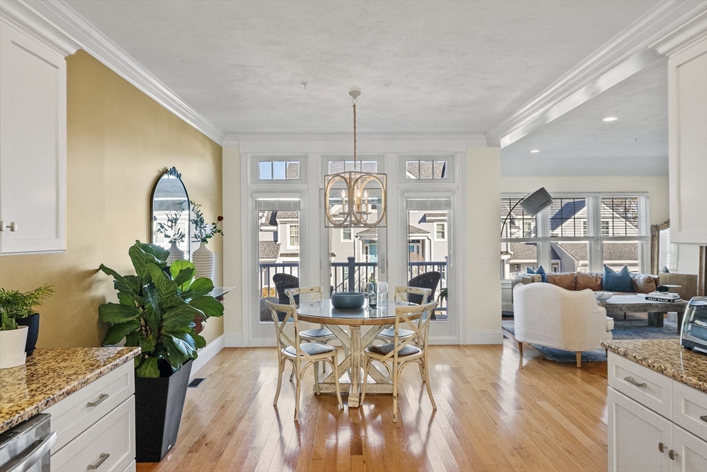 60 Robbins Road, Unit 25 Plymouth, MA 02360 - Photo 20 of 42 a view of a dining room with furniture window and wooden floor