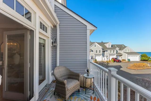 a balcony view with couple of chairs