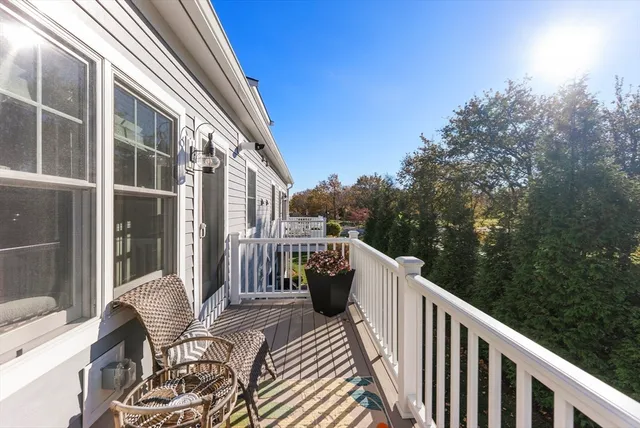 a balcony view with a seating space