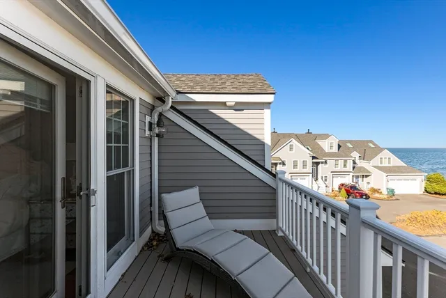 a view of a balcony with furniture