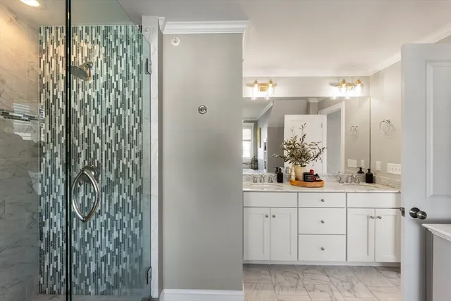 a bathroom with a shower and a sink