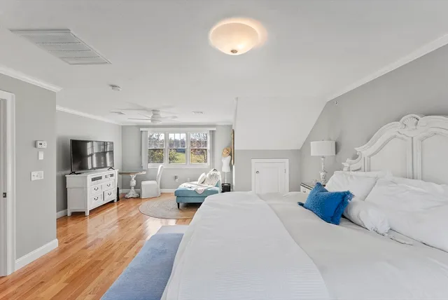 a living room with furniture large window and flat screen tv