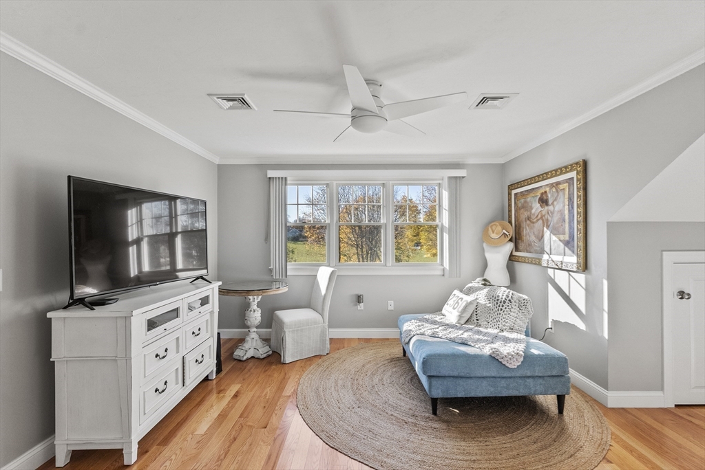 60 Robbins Road, Unit 25 Plymouth, MA 02360 - Photo 42 of 42 a living room with furniture and a flat screen tv
