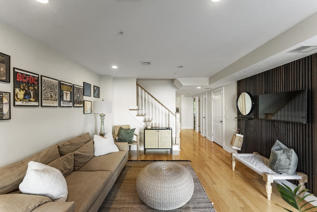 60 Robbins Road, Unit 25 Plymouth, MA 02360 - Photo 10 of 42 a living room with furniture and a large window