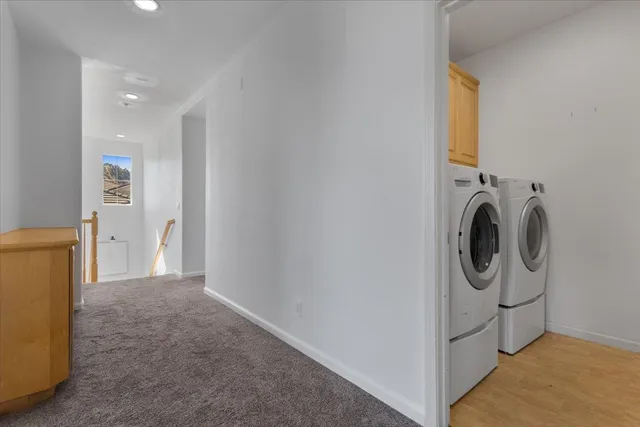 a view of a storage & utility room with washer and dryer