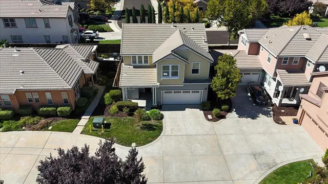 a aerial view of a house with a yard