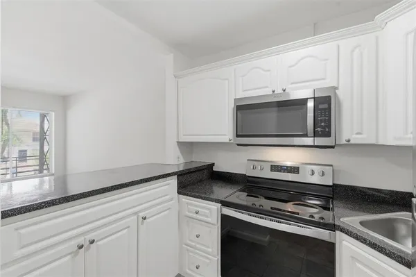 a close view of kitchen countertops with wooden floor