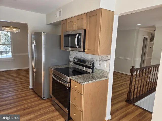 a view of front door with wooden floor