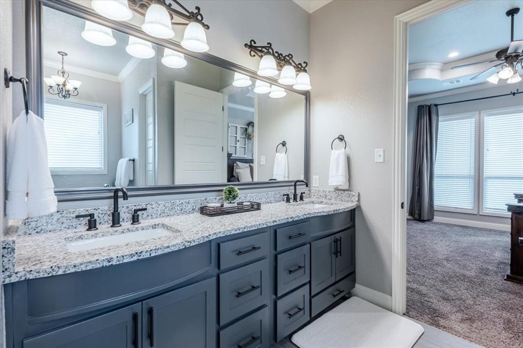 104 Lagrange Court Weatherford, TX 76088 - Photo 14 of 25 a bathroom with double sink and a mirror
