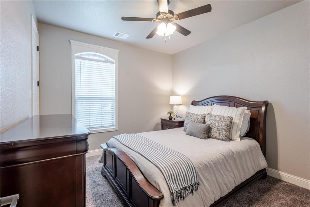 104 Lagrange Court Weatherford, TX 76088 - Photo 17 of 25 a bedroom with a bed and a window