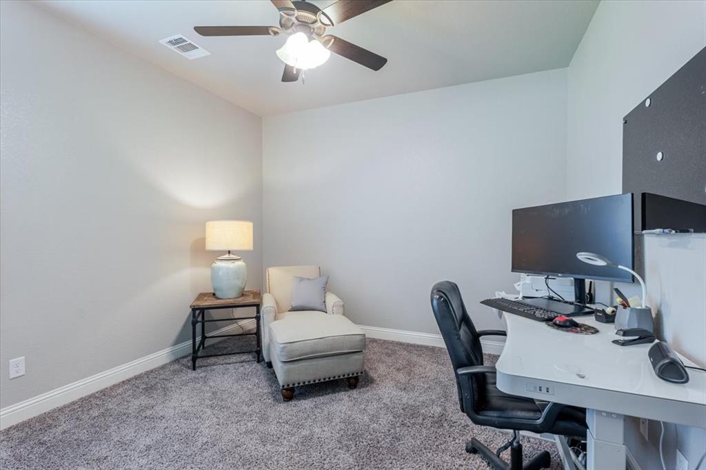 104 Lagrange Court Weatherford, TX 76088 - Photo 18 of 25 a workspace with furniture and lamp