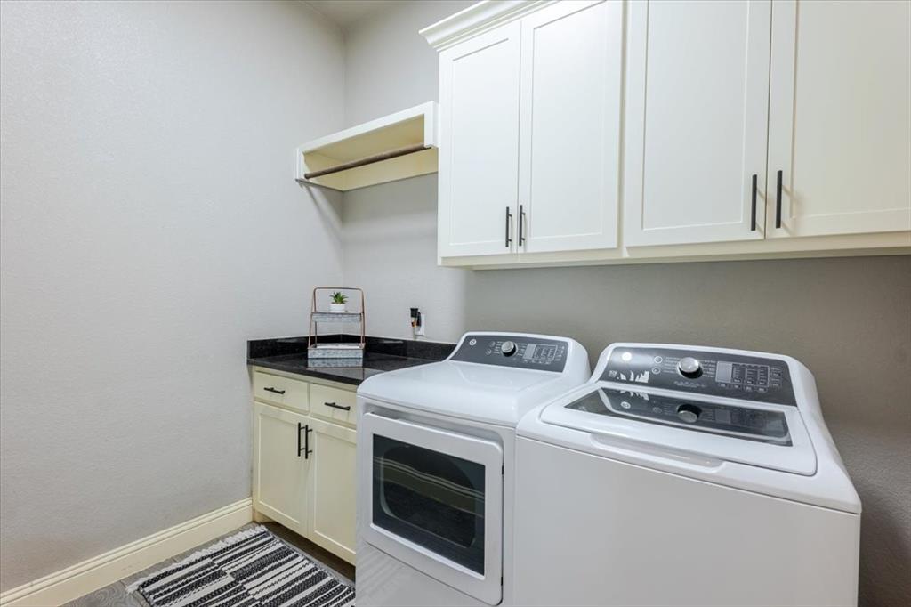 104 Lagrange Court Weatherford, TX 76088 - Photo 22 of 25 a utility room with dryer and washer