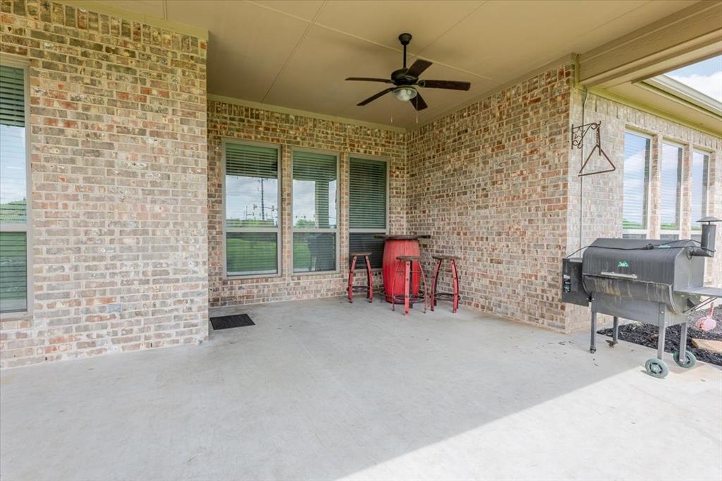 104 Lagrange Court Weatherford, TX 76088 - Photo 23 of 25 a view of a livingroom with lounge chair and a ceiling fan