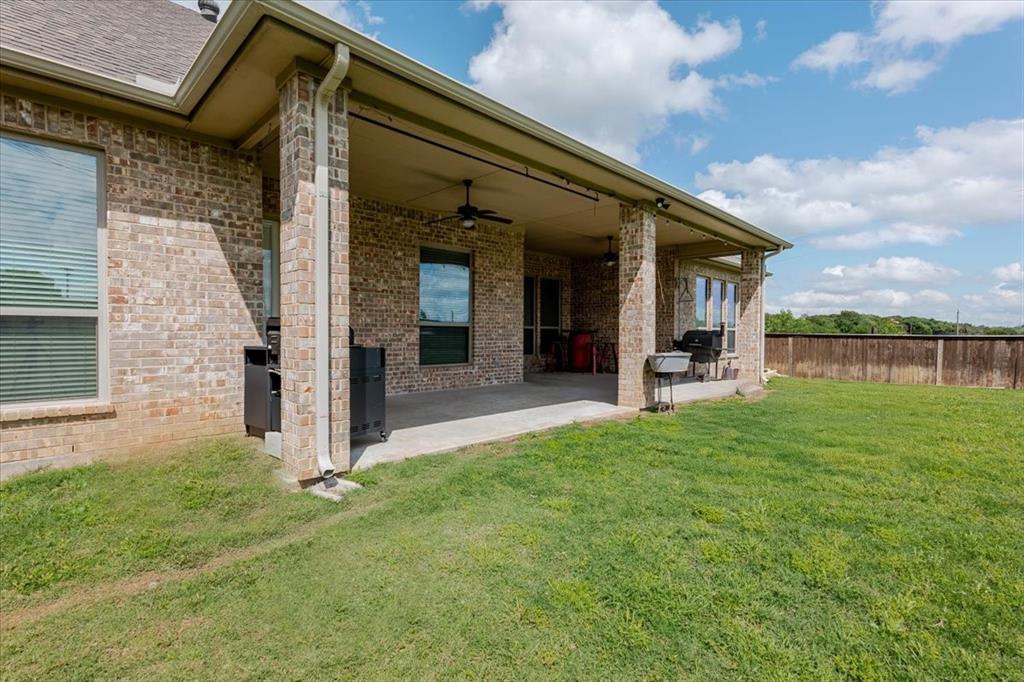 104 Lagrange Court Weatherford, TX 76088 - Photo 24 of 25 front view of a house with a yard
