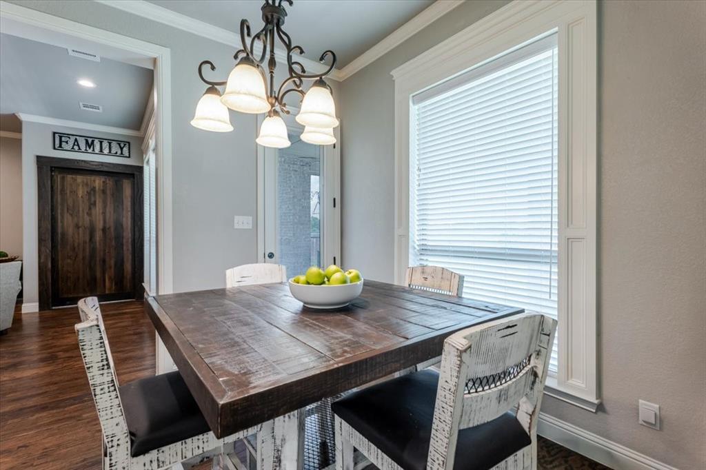 104 Lagrange Court Weatherford, TX 76088 - Photo 8 of 25 a view of a dining room with furniture and wooden floor