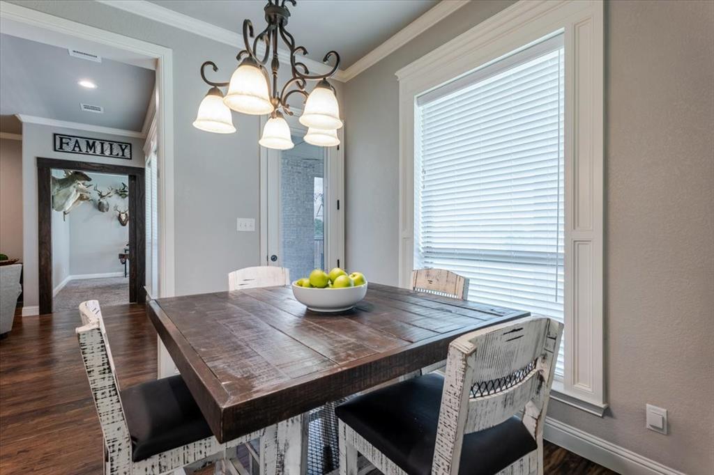 104 Lagrange Court Weatherford, TX 76088 - Photo 9 of 25 a view of a dining room with furniture and wooden floor