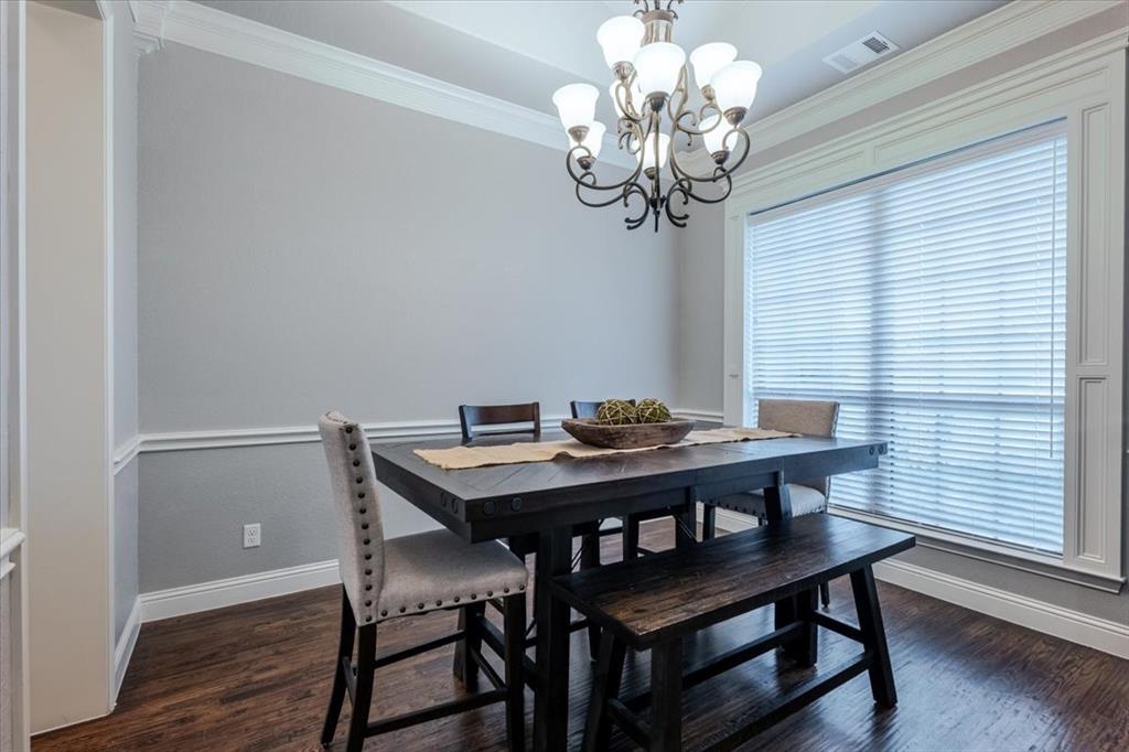 104 Lagrange Court Weatherford, TX 76088 - Photo 10 of 25 a view of a dining room with furniture wooden floor and chandelier