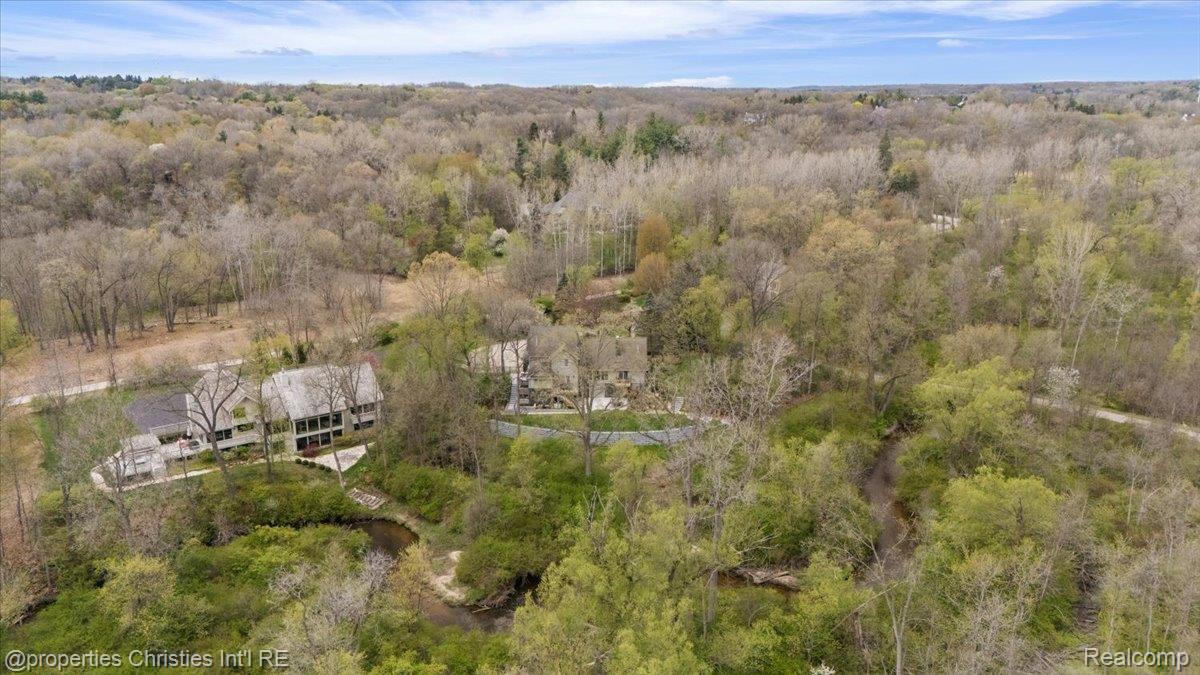 1071 Woodbridge Lane Rochester, MI 48306 - Photo 74 of 76 Drone / aerial view of a heavily wooded area