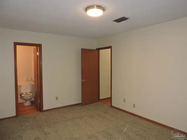 an empty room with a bathroom