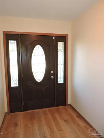 a bedroom with a bed and a mirror