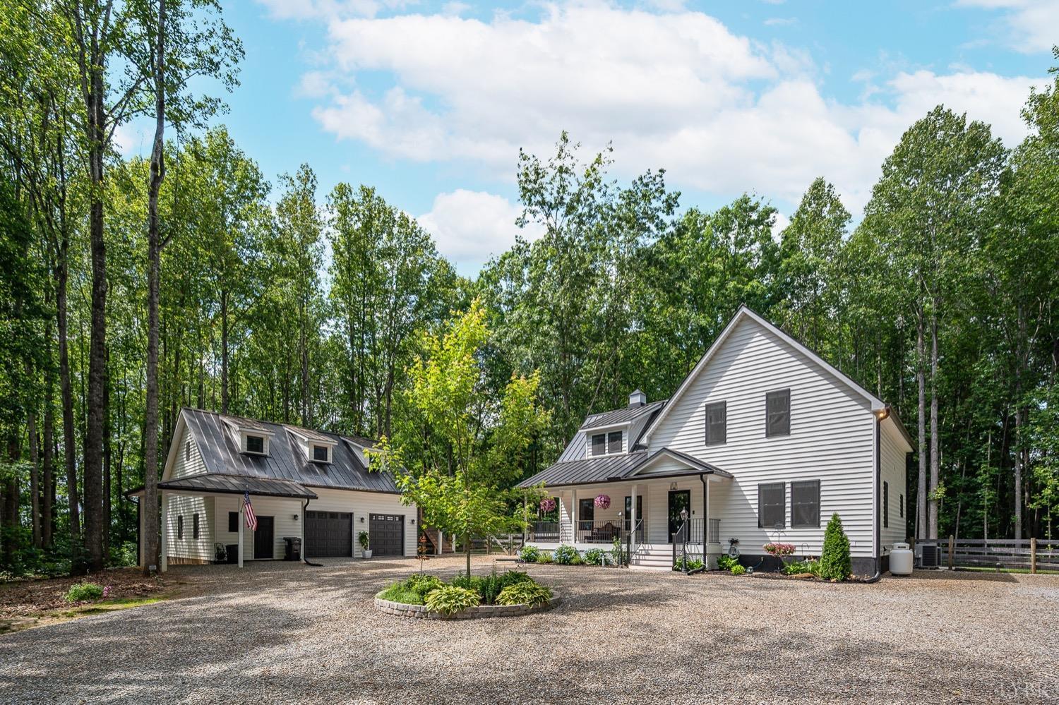 51 Hughes Road Farmville, VA 23901 - Photo 1 of 63 a front view of a house with a garden and trees