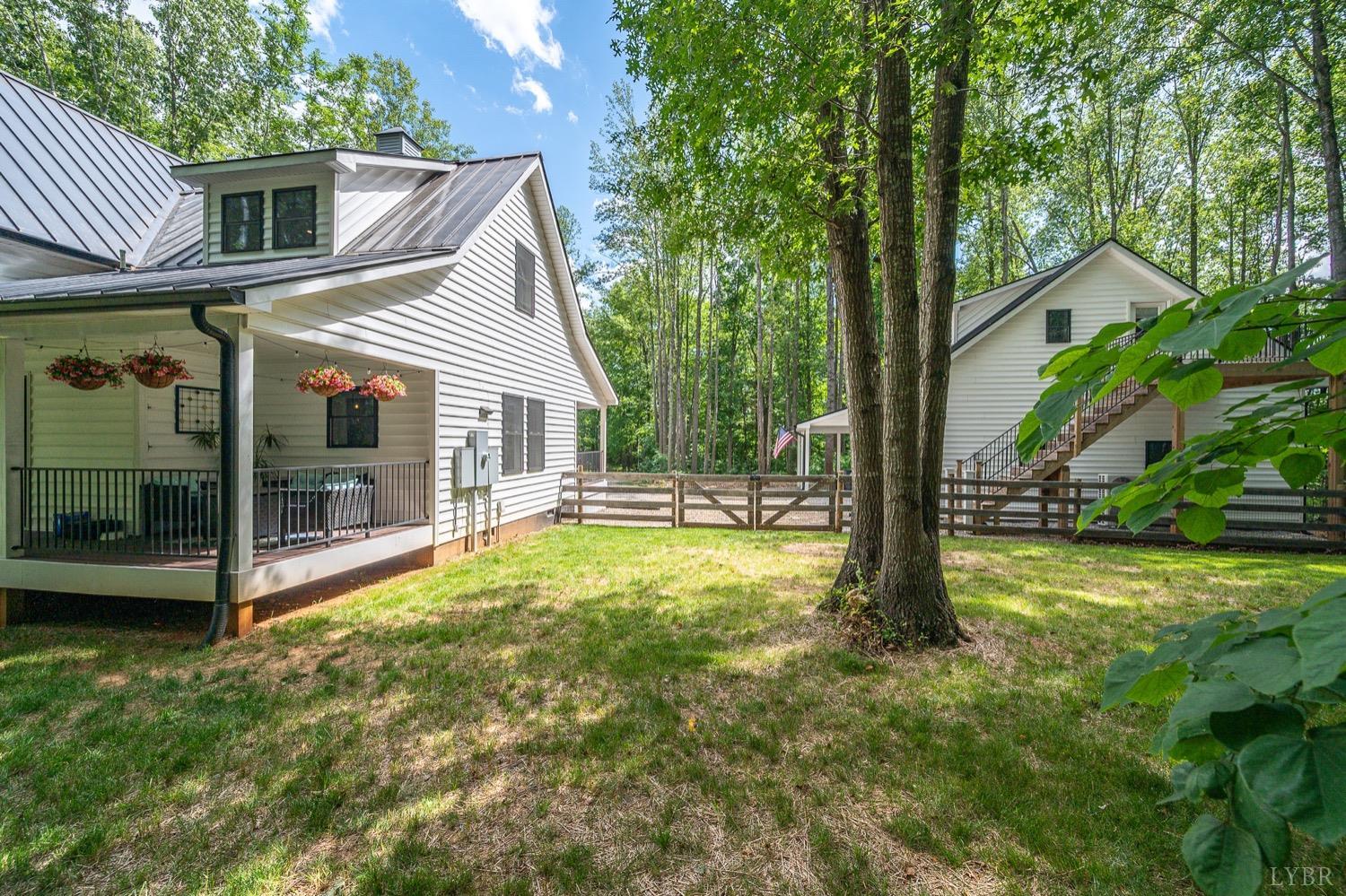 51 Hughes Road Farmville, VA 23901 - Photo 51 of 63 a view of a house with backyard and sitting area