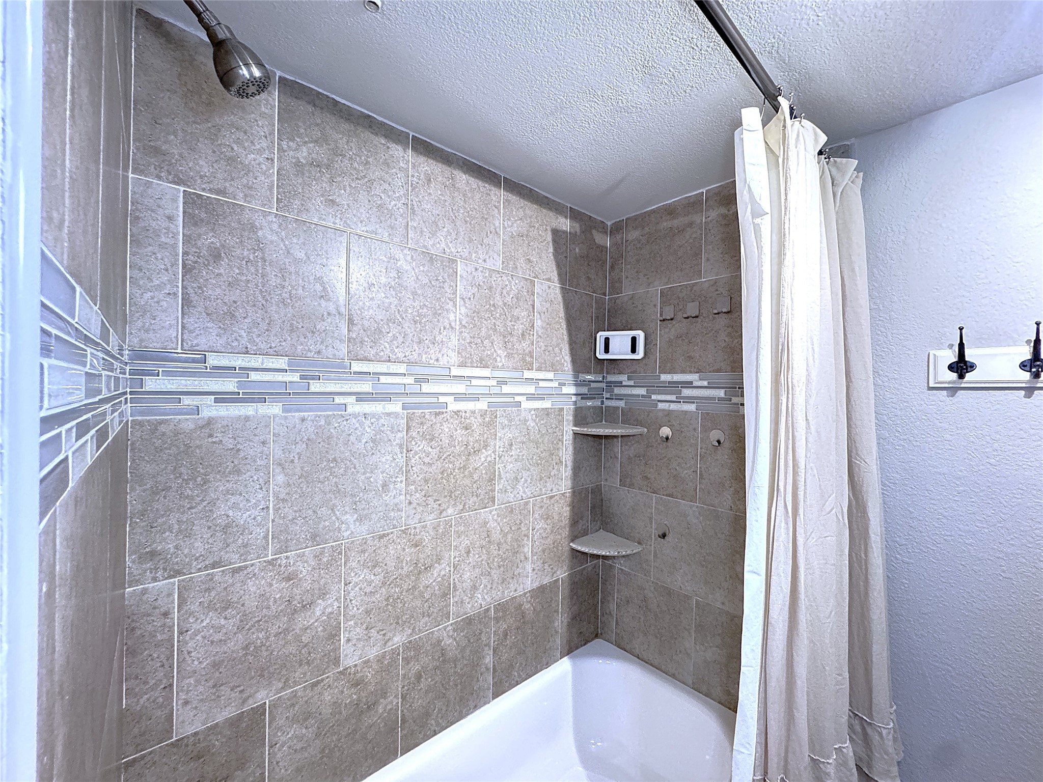 10110 Forum W Drive, Unit 421 Houston, TX 77036 - Photo 19 of 27 a bathroom with a shower and a toilet