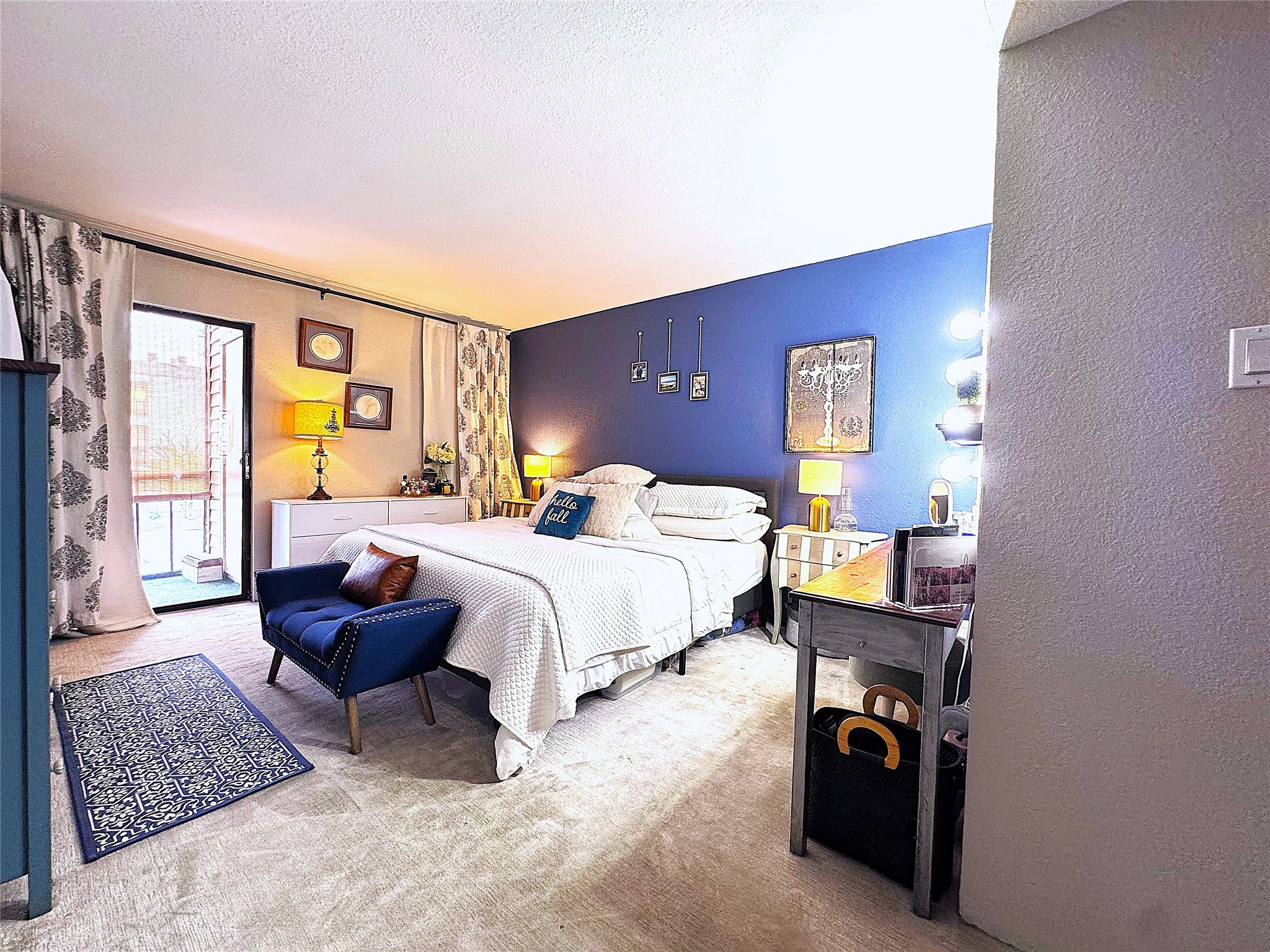 10110 Forum W Drive, Unit 421 Houston, TX 77036 - Photo 3 of 27 a bedroom with a bed and wooden floor