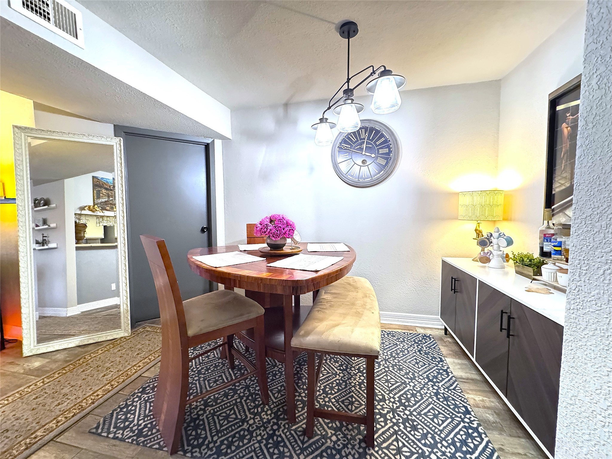 10110 Forum W Drive, Unit 421 Houston, TX 77036 - Photo 7 of 27 a view of a dining room and kitchen with a table chairs