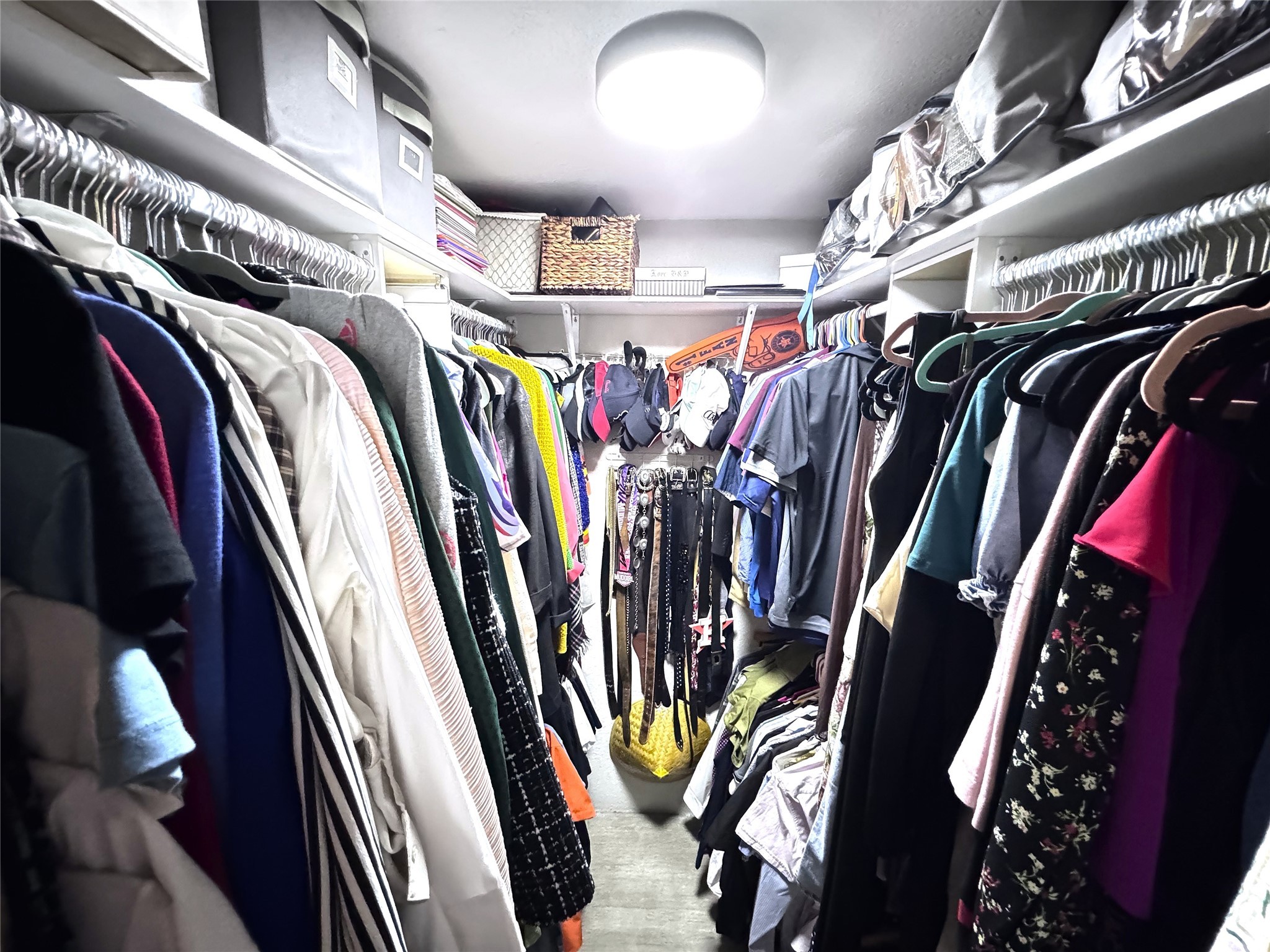 10110 Forum W Drive, Unit 421 Houston, TX 77036 - Photo 8 of 27 a view of walk in closet with clothes and shoes