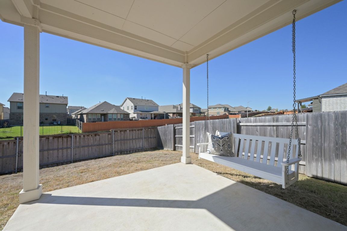 280 Pepperbark Loop Buda, TX 78610 - Photo 28 of 38 Fenced backyard featuring a patio area and a residential view