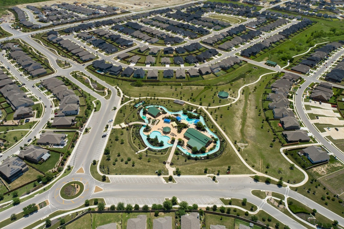 280 Pepperbark Loop Buda, TX 78610 - Photo 34 of 38 Aerial view of property and surrounding area featuring nearby suburban area